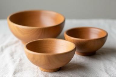 Set of small wooden bowls for dips and nuts